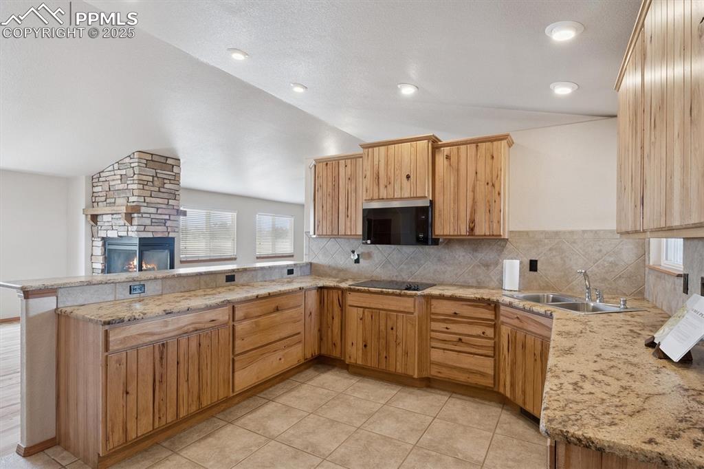 Image 12 of 42: Gourmet kitchen with custom cabinets, granite and all new appliances