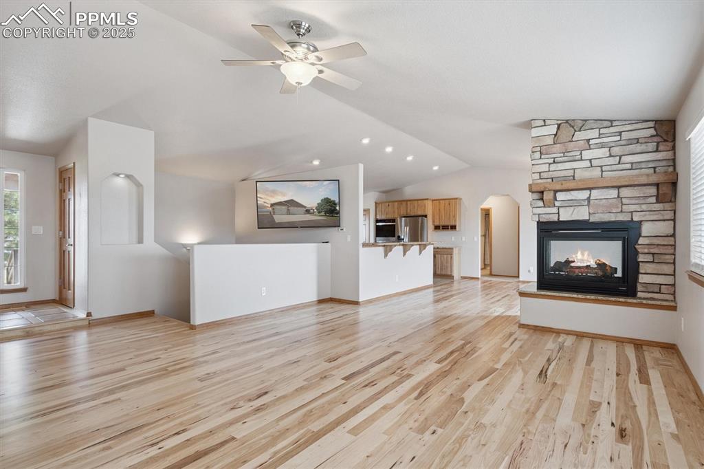 Image 20 of 42: Damily room looking towards basement stairway and kitchen/dining