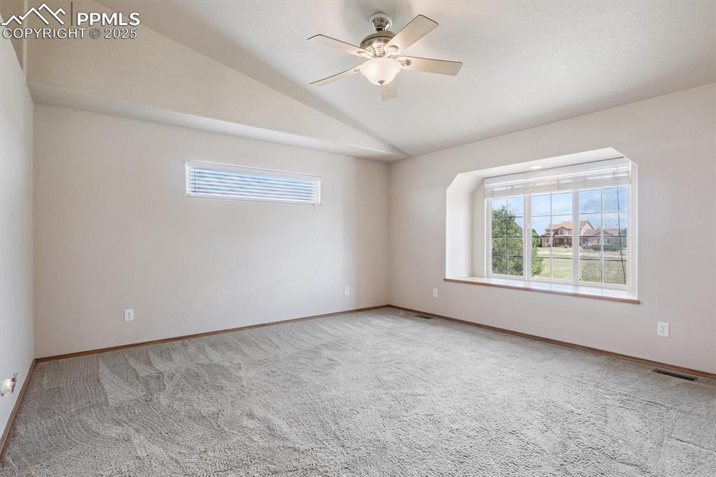 Image 22 of 42: Primary bedroom with window seat and great views out East
