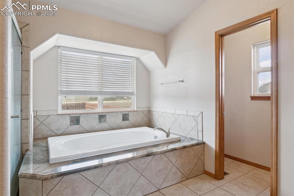 Image 24 of 42: Soaking tub in primary suite