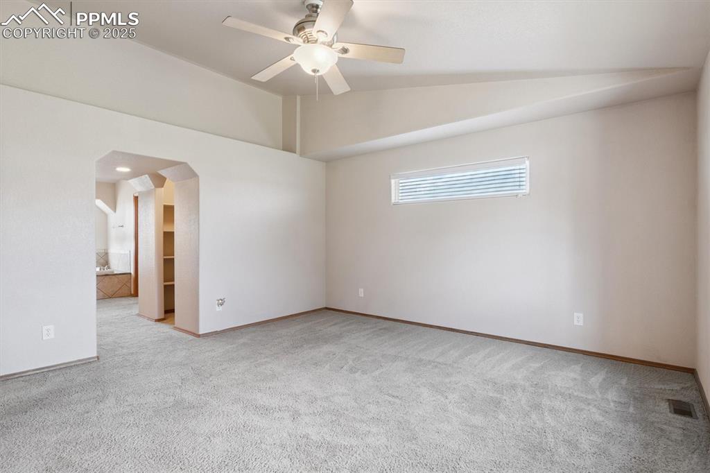 Image 26 of 42: Primary bedroom looking towards bathroom 