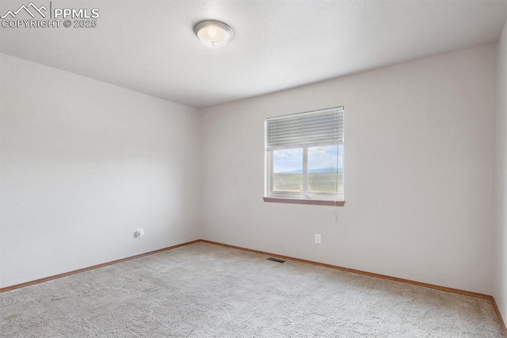 Image 27 of 42: Bedroom 2 on main floor