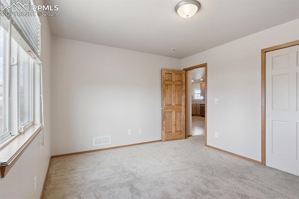 Image 28 of 42: Bedroom 2 on main floor