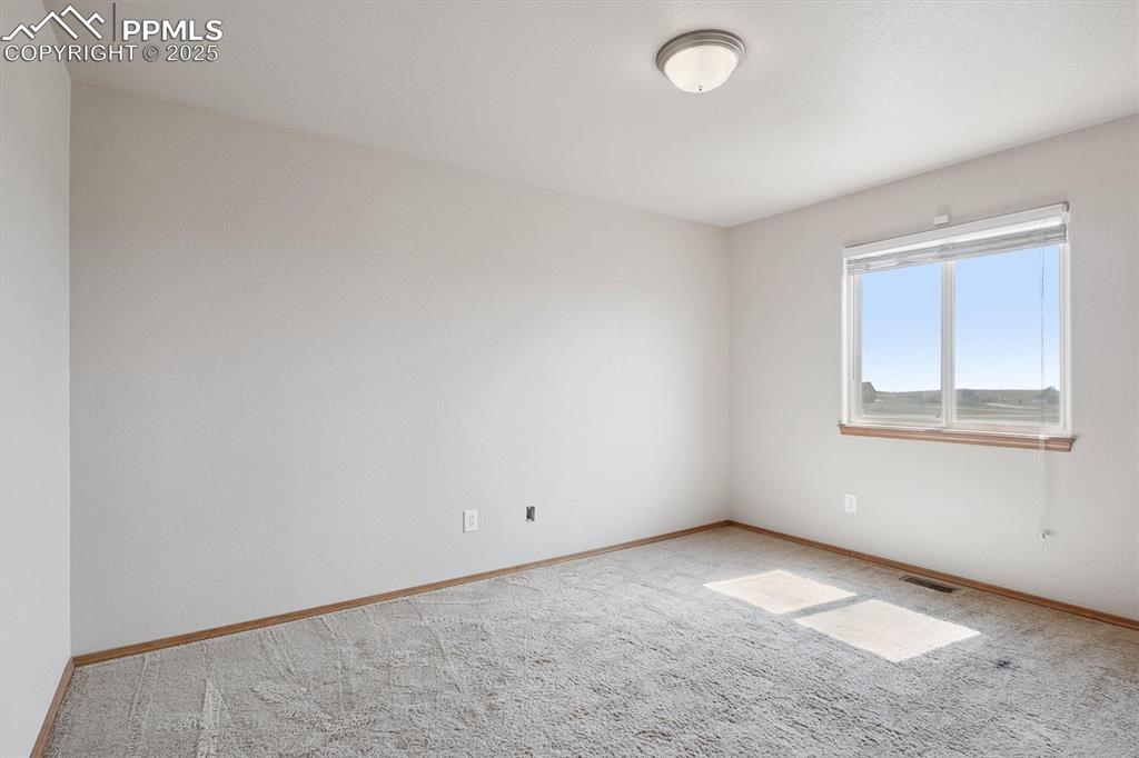 Image 30 of 42: Bedroom 3 on main floor