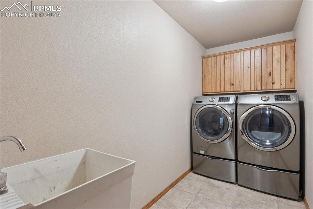 Image 32 of 42: Mud room with utility sink - washer/dryer stay