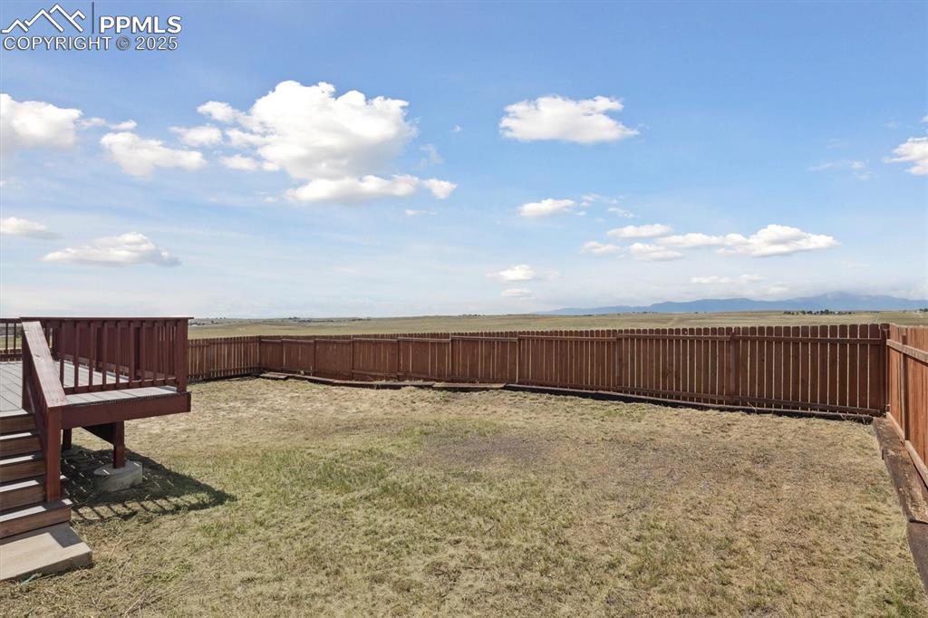 Image 35 of 42: Fenced yard for pets 