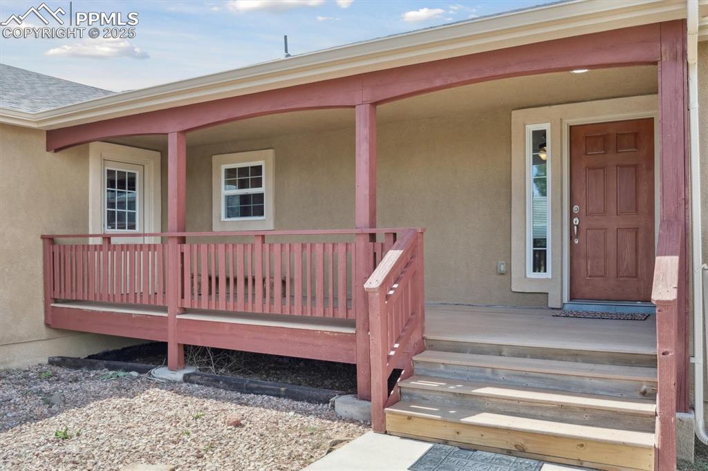 Image 5 of 42: Front and side entrance off of covered front porch
