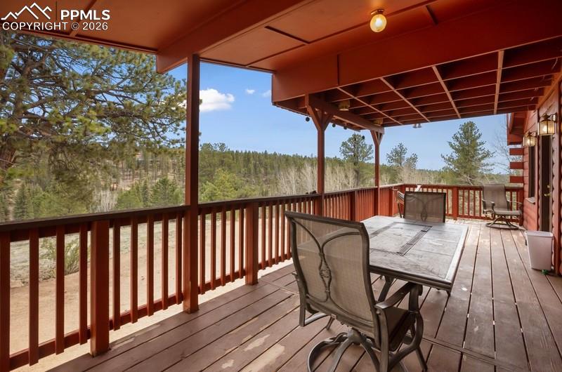 Image 5 of 32: Wooden deck with outdoor dining space