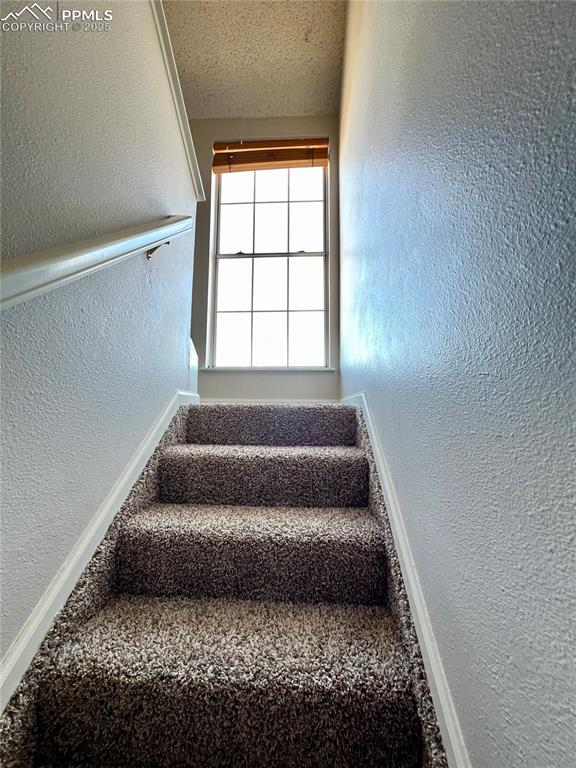 Image 13 of 24: Stairs to the second level