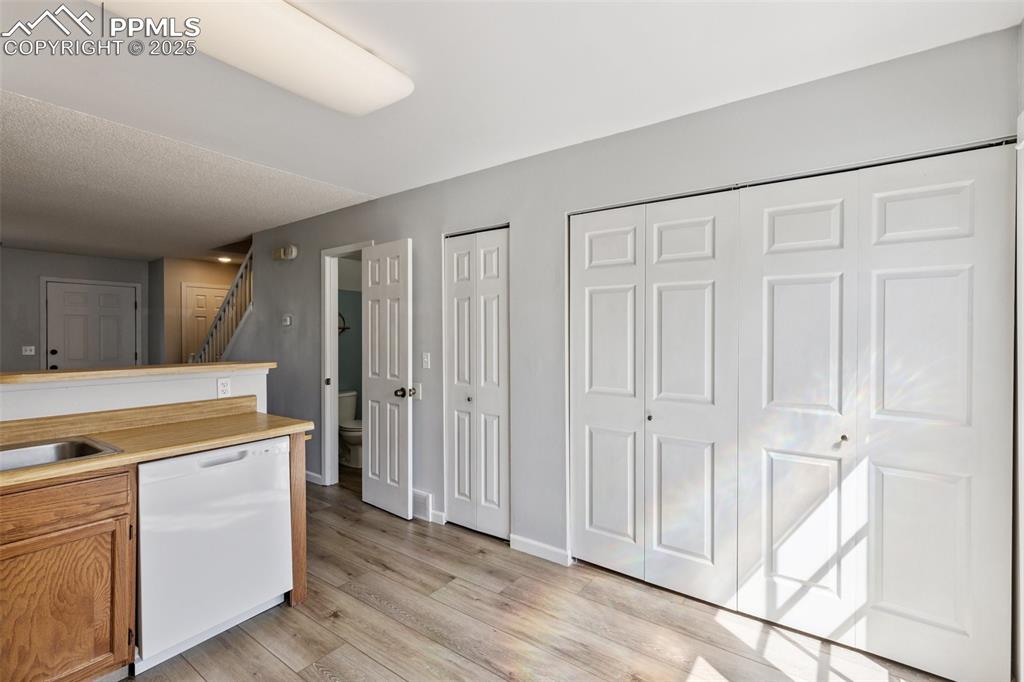 Image 11 of 24: View toward laundry area and half bath