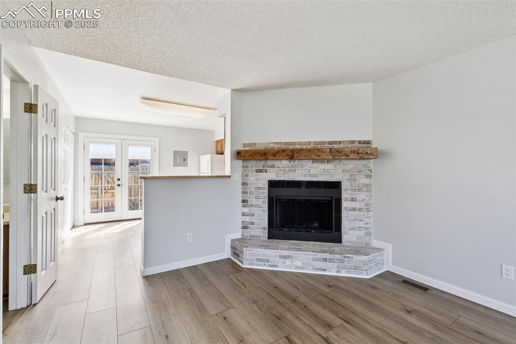 Image 6 of 24: Beautiful wood burning fireplace