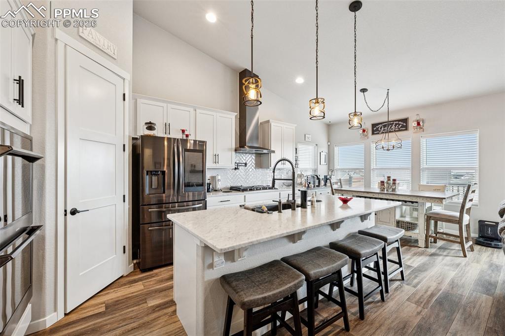 Image 10 of 40: Great countertop space, plenty of seating at the island bar and room for a 