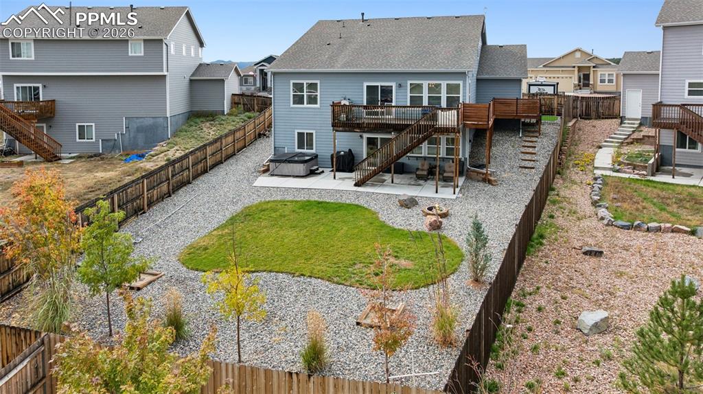 Image 5 of 40: Clean and well-maintained... fire pit and hot tube stay with the home for t