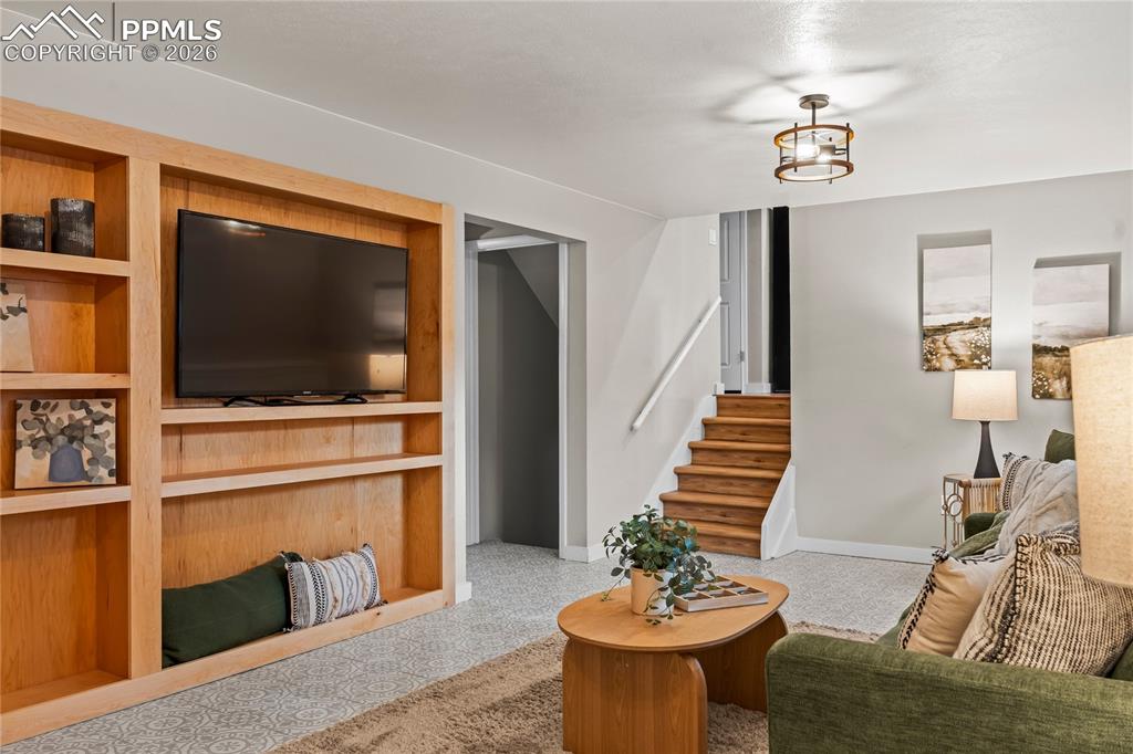 Image 26 of 50: The ultimate "Wow" factor! This lower-level den features a massive, hand-ma