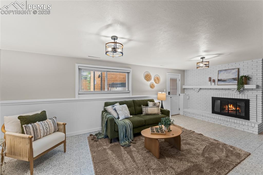 Image 28 of 50: This bright transition space features soft, neutral tones and patterned car