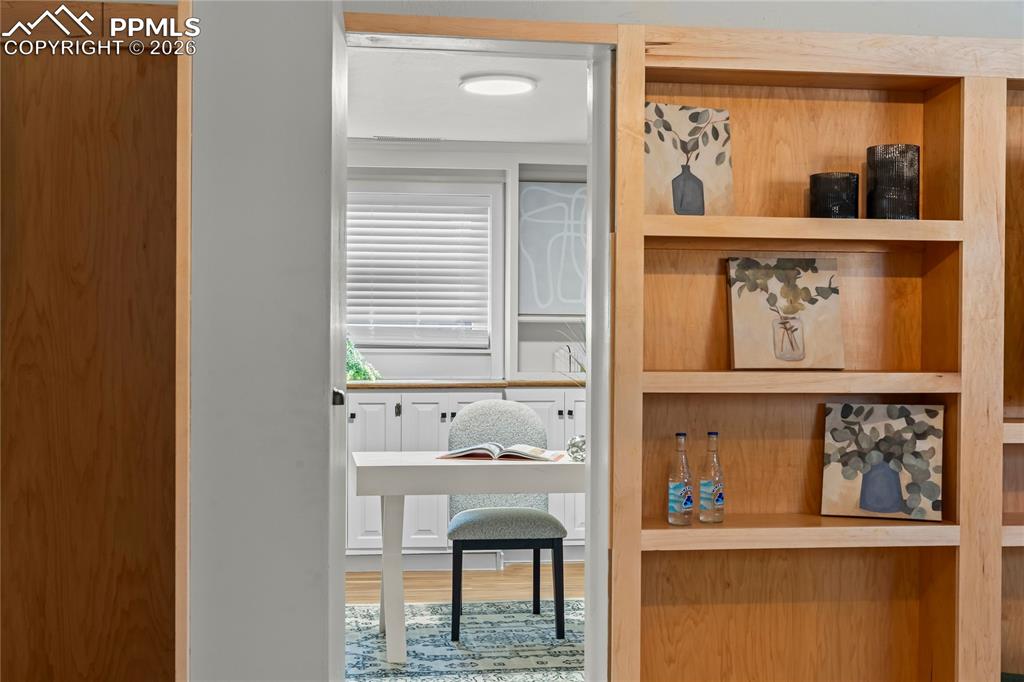 Image 30 of 50: A closer look at the bespoke maple shelving. This hand-crafted woodwork con