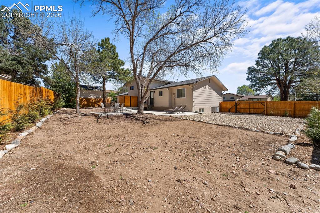 Image 46 of 50: our own private sanctuary! This massive backyard is fully enclosed by a pre