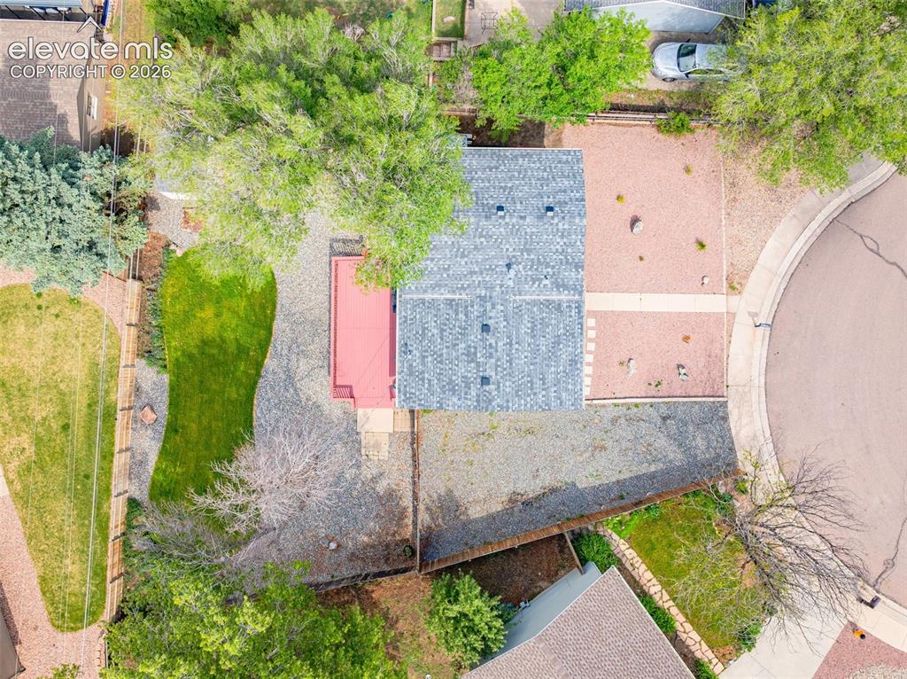 Image 28 of 33: Plenty of Room for a garage or Car Port on the left side of the house