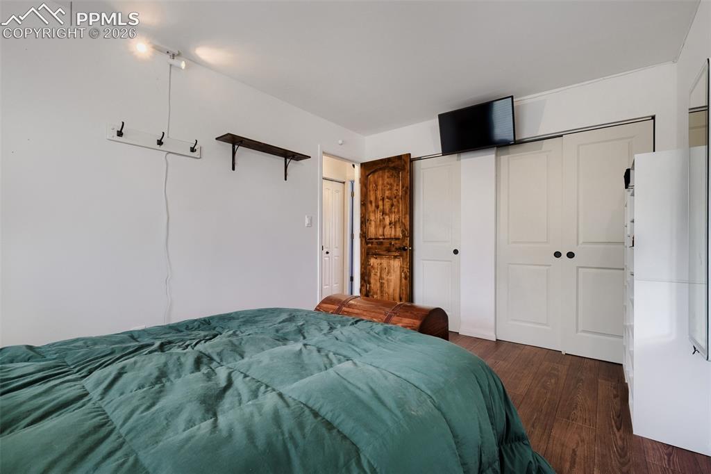 Image 17 of 28: Dining area featuring wood-finish flooring and a glass-paneled patio door