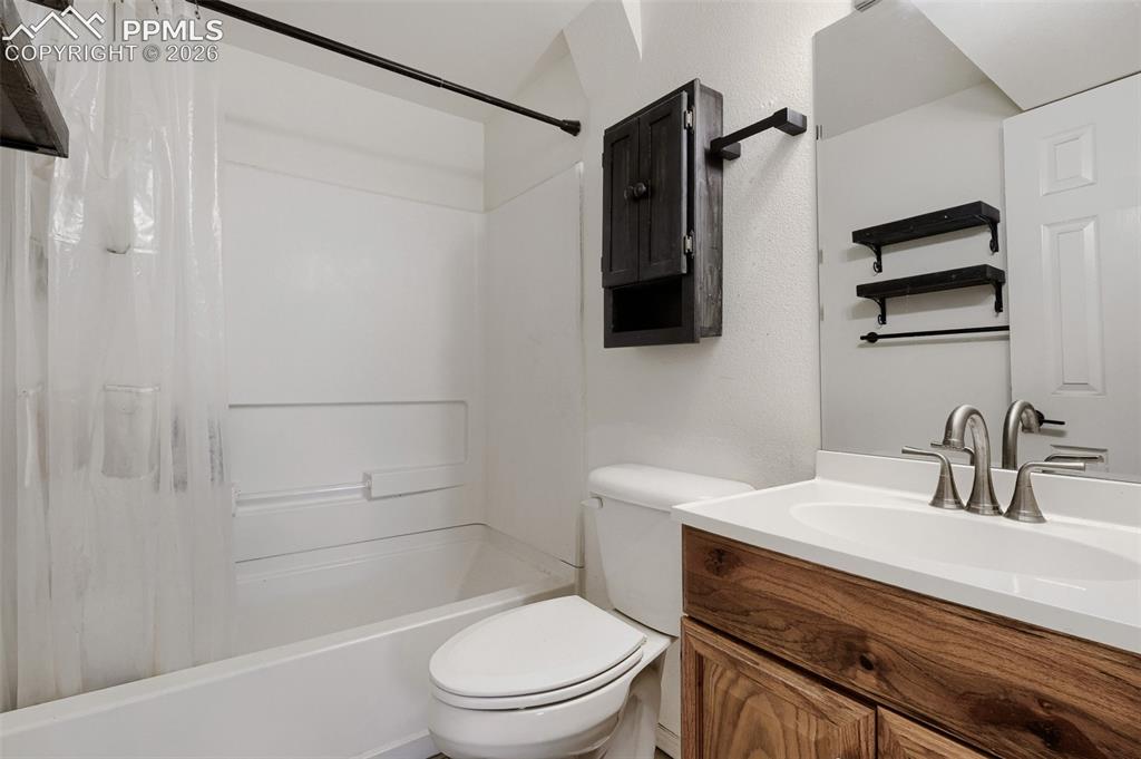 Image 23 of 28: Wood-finish flooring throughout, featuring a double-pane window, ceiling-mo