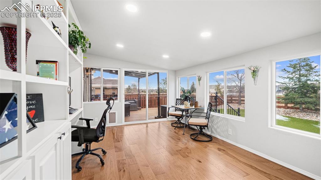 Image 16 of 42: Office space featuring light wood-type flooring, recessed lighting, and hea