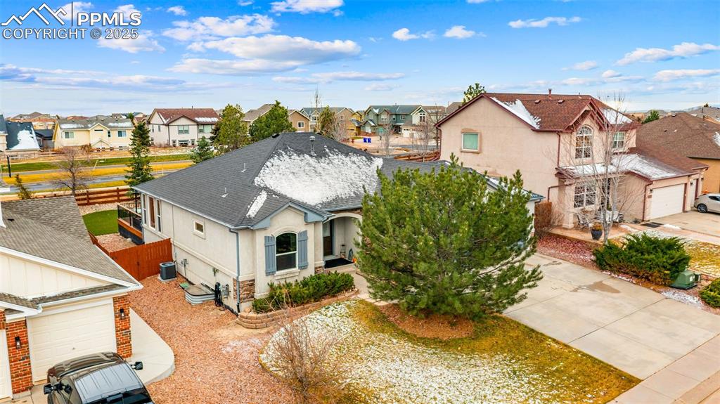 Image 4 of 42: View of front of home featuring roof with shingles, a residential view, a g