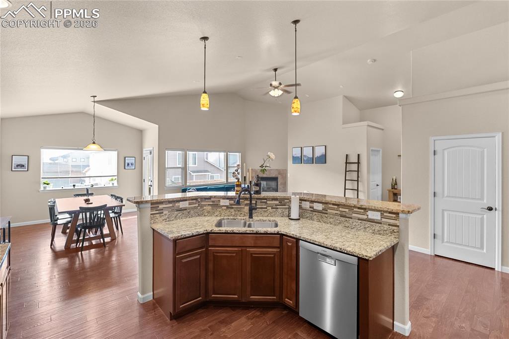 Image 10 of 41: Open floor plan. Gas fireplace.