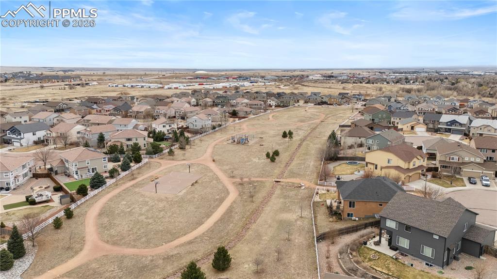 Image 39 of 41: Aerial view of community to include walking trails and playground area.