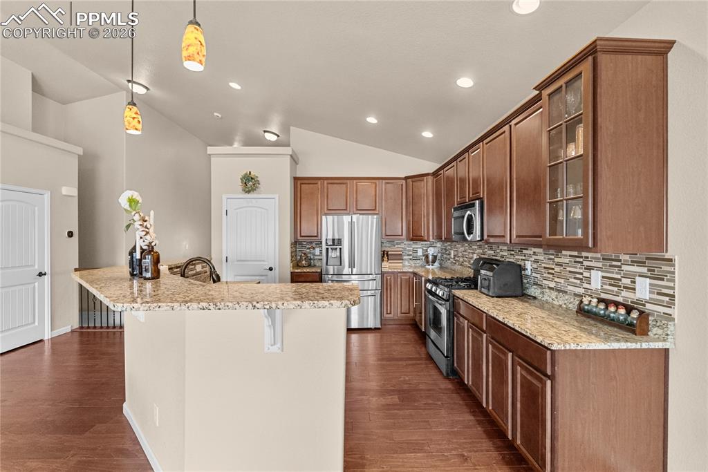 Image 9 of 41: Open floor plan. Granite countertops.