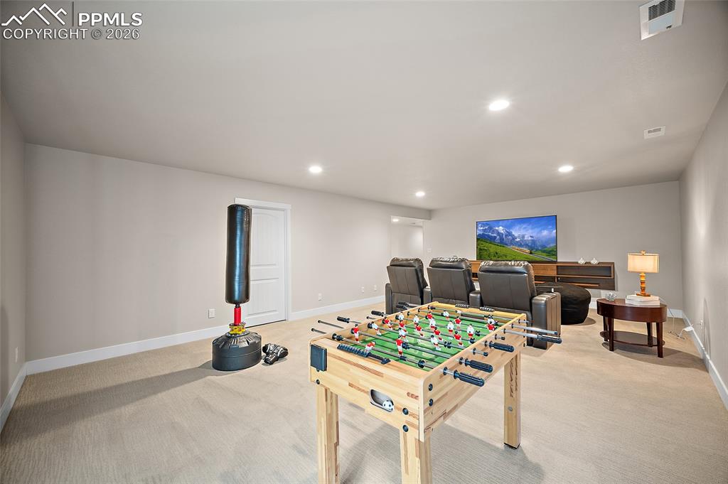 Image 19 of 45: Game room with carpet and recessed lighting
