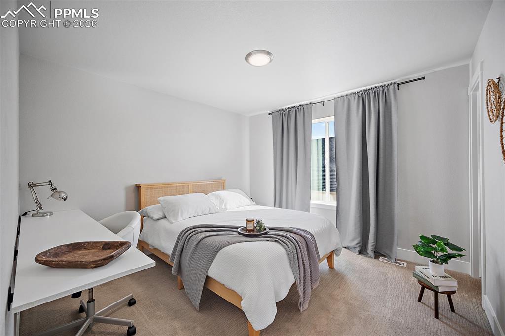 Image 31 of 45: 1st bedroom upstairs with walk in closet.