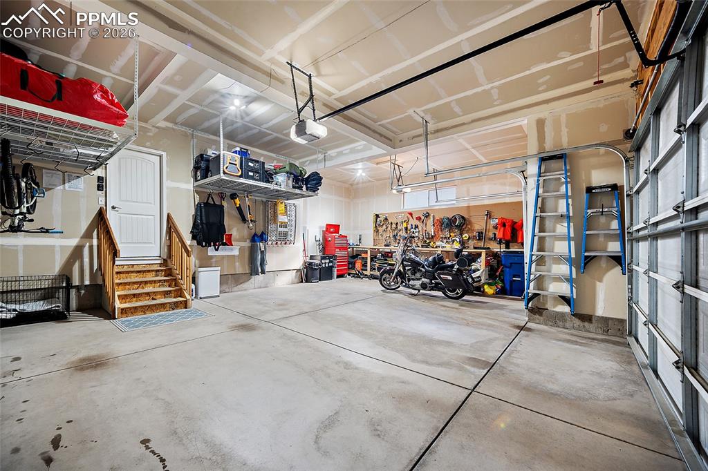 Image 38 of 45: Garage with work station