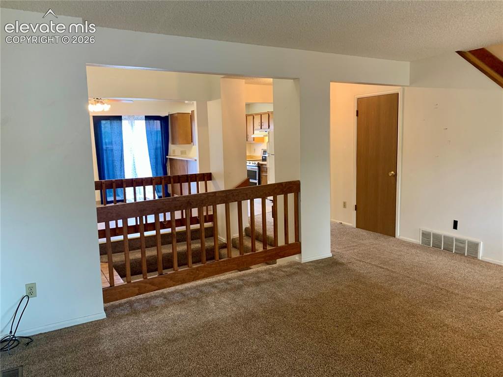 Image 4 of 18: Livingroom view through home to dining room.