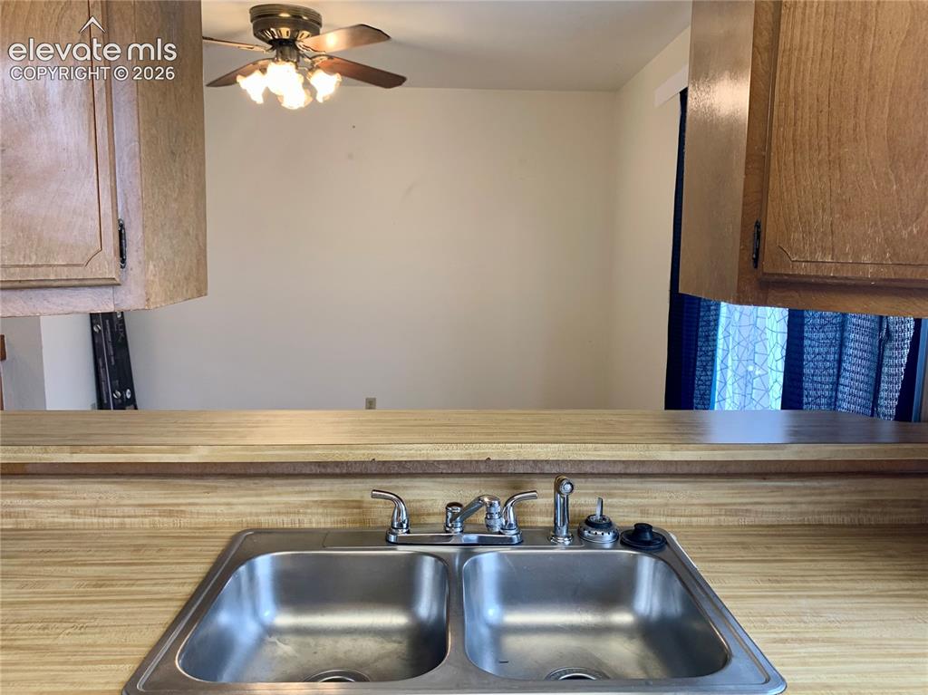 Image 8 of 18: Kitchen view into dining room