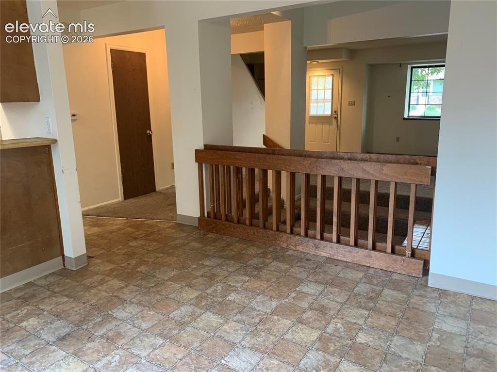 Image 9 of 27: Dining room looking into open living space.