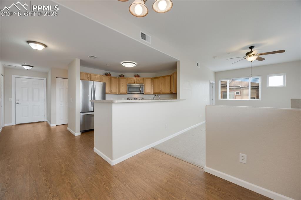 Image 10 of 42: Cozy dining area has laminate floors