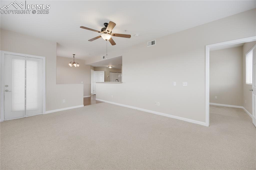 Image 15 of 42: Door on the left leads to the covered balcony. Door on the right leads to a