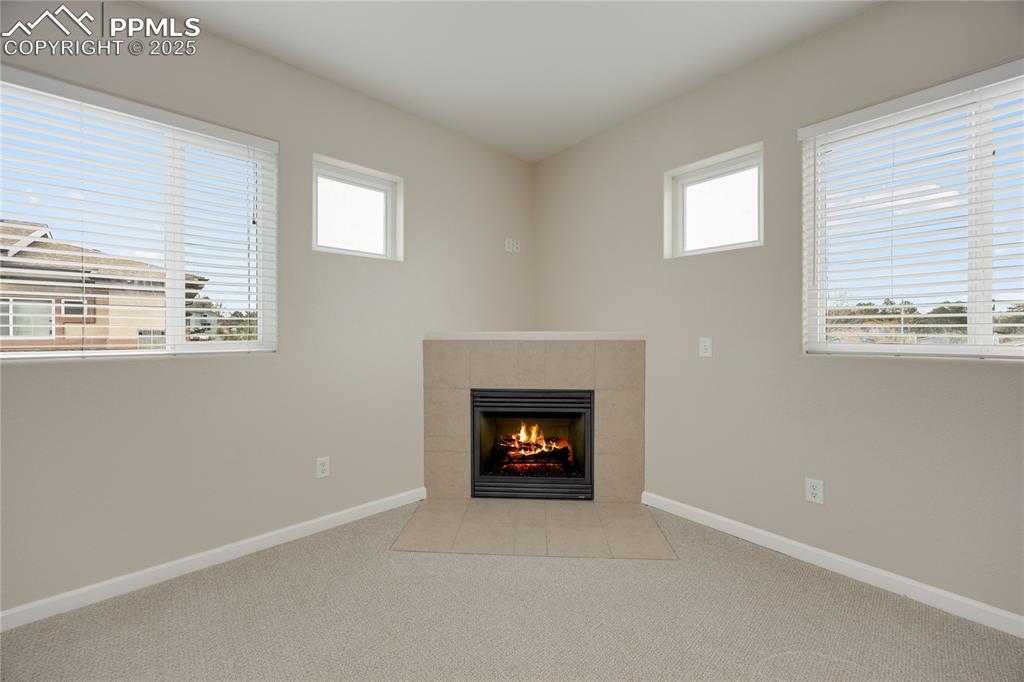 Image 17 of 42: Attractive corner fireplace