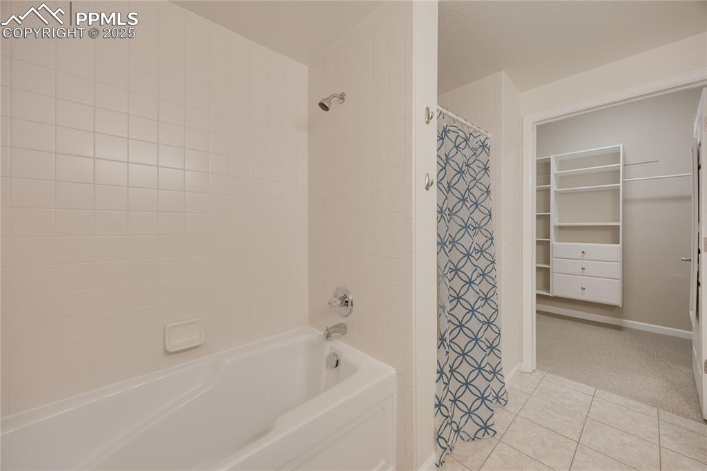 Image 24 of 42: Full bath with stand-alone shower and walk-in closet.