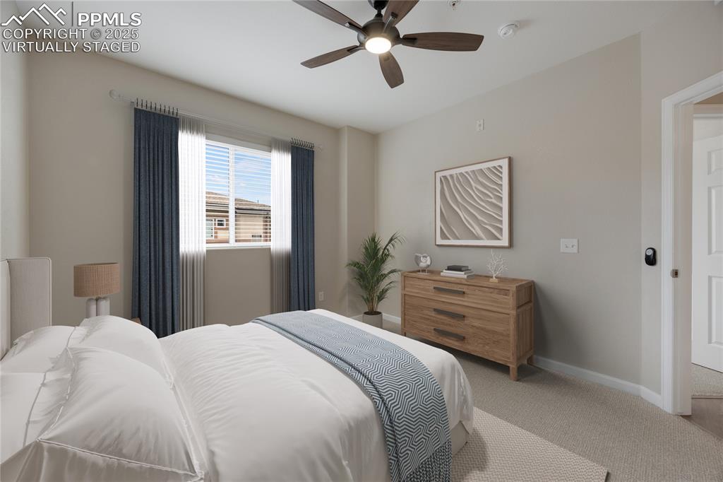 Image 32 of 42: Virtually staged to give viewer an idea of bedroom layout