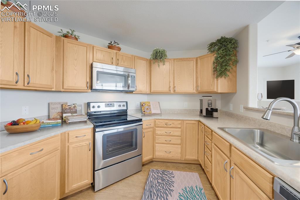 Image 7 of 42: Virtually staged to give viewer an idea of furnished kitchen