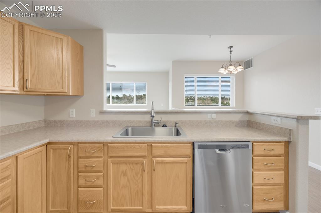 Image 9 of 42: Kitchen looks out over the open living areas