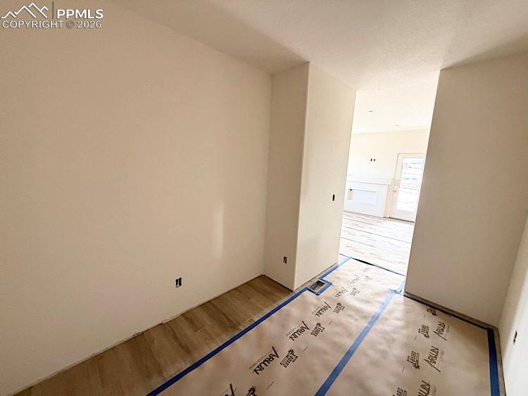 Image 13 of 33: Another view of the Flex Room; office space, dining area, home gym, so many