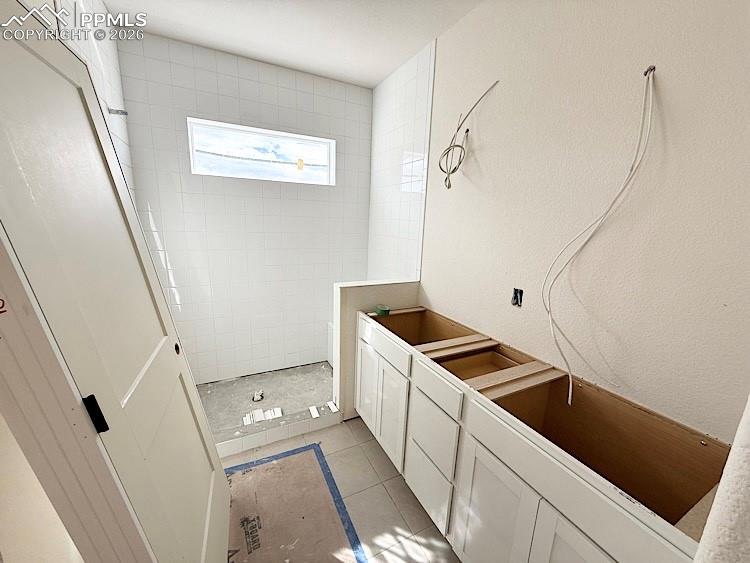 Image 25 of 33: Dual vanities and Shower with Bench in the Primary Bathroom! Please, excuse