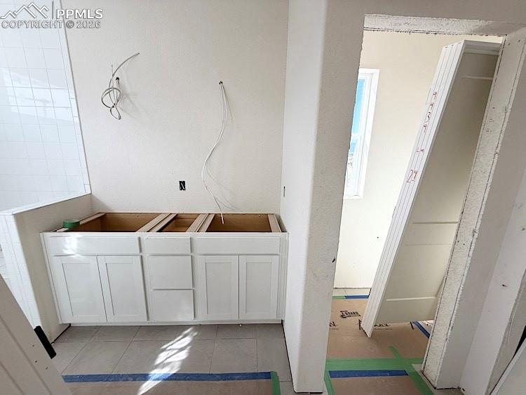 Image 26 of 33: Dual vanities and Shower with Bench in the Primary Bathroom! Please, excuse