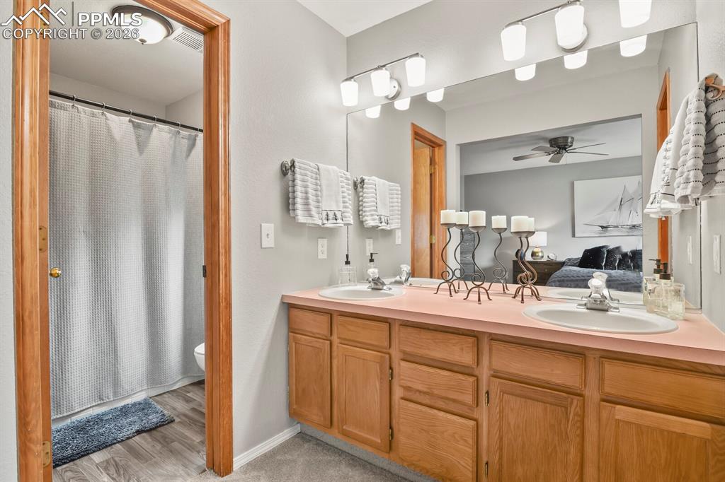 Image 21 of 36: Double sinks in bathroom.