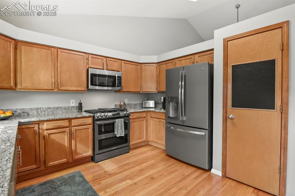 Image 8 of 36: Stainless steel appliances (gas range) that are almost new! Pantry for extr