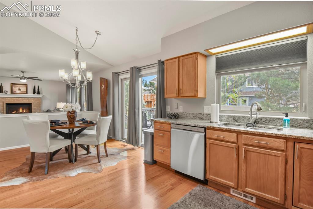 Image 9 of 36: Lots of large windows and vaulted ceilings make this area bright with natur