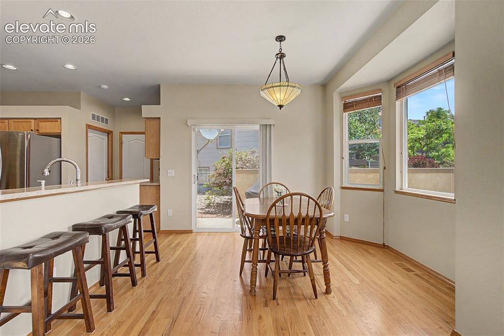 Image 12 of 37: Large Breakfast Nook Opens to Patio!