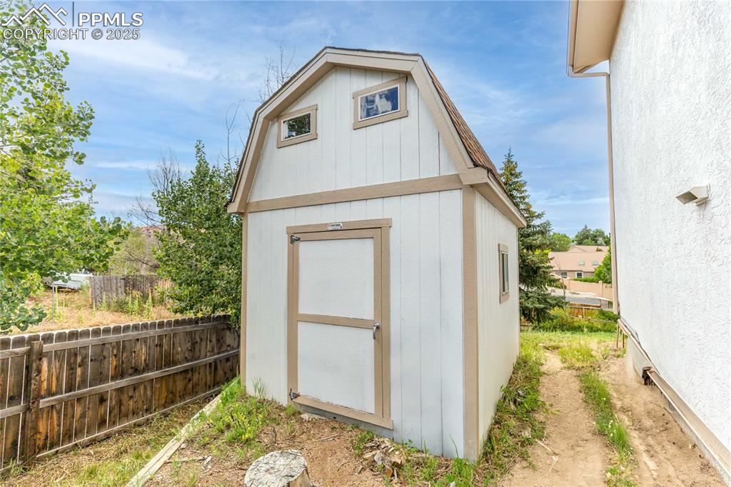 Image 29 of 38: Storage Shed - 1/2 Cord of Wood for Fireplace Included
